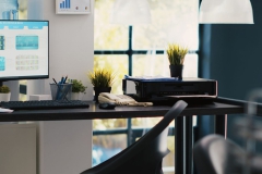 Computer screen in financial department office shows stock exchange indices changing in real time. Desktop PC monitor in workplace with trading indexes showing latest price modifications, panning shot