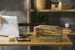 stack-old-coming-book-strips-wooden-desk-scaled