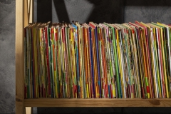 stack-old-coming-book-strips-wooden-shelf-scaled